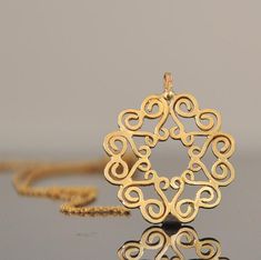 "14k gold necklace, solid gold chain and pendant. This beautiful Mandela necklace will be a perfect gift for Christmas. You can call this fine jewelry pendant a sun, you can call this necklace a flower, mandala, or even hidden Magen-David.... That is what so special in this 14 k gold necklace - the little many details join together to interesting form that inspire the imagination. The pendant is 14k yellow solid gold with 14k gold chain The mandala: * 14k solid gold * Pendant width 2.2 c\"m (0.8 Handmade Elegant Star Of David Jewelry, Gold Bohemian Necklace For Anniversary, Bohemian Gold Necklace For Anniversary, Gold Chain And Pendant, Gold Filigree Necklace, Gift Idea For Mom, Mandala Necklace, Gold Mandala, Filigree Necklaces