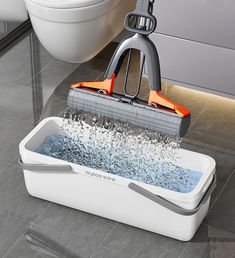 a mop is being used to clean a bathtub