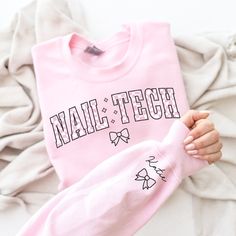 This cute Nail Tech sweatshirt with a checkerboard style will be the perfect Nail Artist Esthetician gift for that new Cosmetologist who loves a retro groovy crewneck! Our crewnecks are 100% made in the USA, and we use a high-quality unisex sweatshirt that is insanely soft. In fact, it will be one of the softest, best fitting, most comfortable sweatshirts you've ever owned.   ⭐ PREMIUM QUALITY ⭐ ▪️ 50% Cotton / 50% Polyester ▪️ Made in the USA 👕 SIZING 👕 All our sweatshirts are unisex fit. We Esthetician Gifts, Spanish Shirts, Retro Groovy, Sweat Shirts, Coquette Bow, Trendy Gift, Cosmetology, Esthetician, Nail Tech