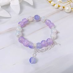 [Size] In picture (string) : 16 cm Bead : 10 mm [String Material]      Wire : keeps its shape, but is harder to put on by yourself.      String : doesn't keep its shape, but is very easy to put on by yourself. (Please note that the string version may look different due to size differences) Picture String, Pictures On String, Crafting Table, Aesthetic Jewellery, Glass Bead Bracelet, Beads Bracelet Design, Bracelet Design, Fairy Costume, Bracelet Ideas