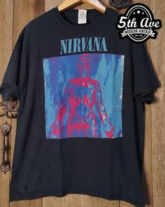 #nirvana #sliver #americanrockband #grunge #alternative #hardrock #rock #rockband #rockt #rocktee #band #bandt #bandtee #bandtshirt #rockbandtshirt #rockbandtee #tshirt #tee #streetwear #vintagereprint #y2k #shopvintage #thrift #thriftshop #90sstyle #vintageclothing #vintaget #bootleg Alternative Band Logo Tops For Music Festivals, Alternative Style Tops With Band Logo For Music Festivals, Alternative Tops With Band Logo For Music Festivals, Alternative Style T-shirt For Concerts, Grunge Band Logo T-shirt For Music Festivals, Alternative Style Graffiti Print T-shirt For Fans, Alternative Style Cotton T-shirt For Music Festival, Alternative Graffiti Print T-shirt For Fan Merchandise, Alternative Graffiti Print T-shirt For Fans