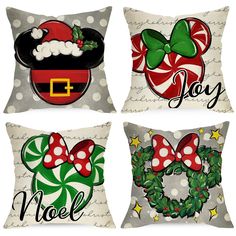 four pillows with christmas designs on them, one has a santa hat and the other has a wreath