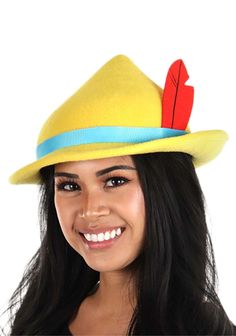 a woman wearing a yellow hat with a red feather on the top and blue band around the brim