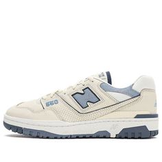 The New Balance 550 Vintage Indigo Beige is a classic yet modern sneaker with retro-style design elements. Its cream-colored upper is crafted from luxurious leather with highlights of navy and sky blue accents on the ankle collar, tongues, and "550" labeling. Moreover, this sneaker features basketball branding on the tongues along with the legendary “N” logo on the sides for an unmistakable look. These sneakers are finished off with white and light blue soles for an additional touch of sophistication. An ideal addition to any fashion aficionado's wardrobe, these stylish and high-quality sneakers are sure to make you stand out in any crowd. With their unique look which combines vintage appeal with modern design elements, the New Balance 550 Vintage Indigo Beige shoes offer the perfect blend New Balance 550 Indigo Beige, New Balance 550 Beige Vintage Indigo, Nee Balance 550 Outfit, New Balance 550 Vintage Indigo, New Balance 550 Beige, Retro Basketball Shoes, Trendy Shoes Sneakers, Best Shoes For Men, Vintage Sneakers