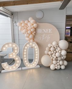 balloons are displayed in front of the number 30 sign