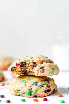 two cookies stacked on top of each other with sprinkles and chocolate chips