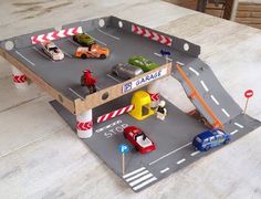 a table with cars and trucks on it