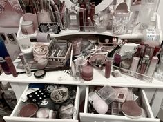 an organized makeup drawer filled with cosmetics and personal care items