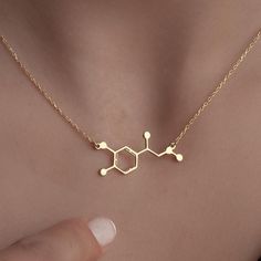 Molecule Chemical Structure Necklace Discover The Perfect Blend Of Science And Style With Our Molecule Chemical Structure Necklace. This Exquisite Piece Features The İntricate Design Of The Dopamine And Adrenaline Molecules, Making İt A Unique Addition To Any Jewelry Collection. Whether You'Re Seeking Motivation Or Simply Want To Celebrate The Wonders Of Science, This Necklace Serves As A Stunning Reminder Of The Joy And Excitement That These Essential Neurotransmitters Bring To Our Lives. Handmade With Care, İt'S An İdeal Gift For Anniversaries, Birthdays, Or Even A Thoughtful Halloween Surprise. Crafted From High-Quality Materials, This Molecular Jewelry Piece İs Not Just A Fashion Statement But A Conversation Starter. Wear İt To İnspire Others Or Give İt To Someone Special Who Shares Yo Adrenaline Molecule, Molecule Necklace, Science Jewelry, Chemical Structure, Silver Gifts, Gifts Christmas, Halloween Gifts, Fashion Statement, Favorite Jewelry