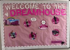 a bulletin board with pink paper and stickers on it that says welcome to the dreamhouse