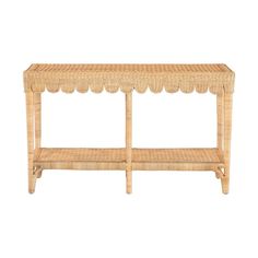 a wicker shelf with scalloped edges on the top and bottom, against a white background