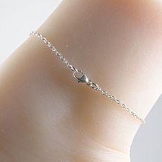 Silver dragonfly anklet made with a lovely and dainty sterling silver dragonfly charm that is suspended on a sterling silver chain with a sterling silver clasp. Choose the size anklet you need from the drop-down menu, bearing in mind that the anklet should be approximately one inch larger than the size of your ankle. The anklet will arrive in an attractive gift box. Silver Minimalist Anklets For Gift, Minimalist Hypoallergenic Sterling Silver Anklets, Adjustable Silver Anklet With Lobster Clasp, Delicate Adjustable Silver Anklets, Minimalist Sterling Silver Anklet With Adjustable Chain, Dainty Sterling Silver Charm Bracelet With Lobster Clasp, Adjustable Delicate Sterling Silver Bracelet As A Gift, Minimalist Sterling Silver Anklets In Silver, Dainty Sterling Silver Anklets