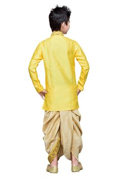 Product Features: Top Color: Yellow Bottom Color: Phone Top Fabric: Silk Bottom Fabric: Silk Pattern And Print: Embroidery Work: Zari And Resham Thread Embroidered Sleeve Type: Full Sleeve Neckline Type: Chinese Collar Closure Type: Button Wash Care: Dry Clean Occasion: Festival Package Contain 1 Top And 1 Bottom Product Type Boys Kurta Pyjama Set Disclaimer: There Will Be Slight Difference In Digital To Actual Image Long Sleeve Kurta With Gold Embroidery For Navratri, Yellow Embroidered Sherwani For Navratri, Yellow Sets With Gold Embroidery For Eid, Diwali Yellow Sets With Gold Embroidery, Festive Yellow Sets With Embroidered Border, Diwali Yellow Kurta With Gold Embroidery, Floral Embroidered Sets For Puja At Eid, Navratri Traditional Long Sleeve Wear With Gold Embroidery, Yellow Sets With Embroidered Border And Traditional Drape