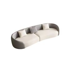 a white couch with two pillows on it