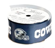 a football helmet ribbon with the word cowboys on it