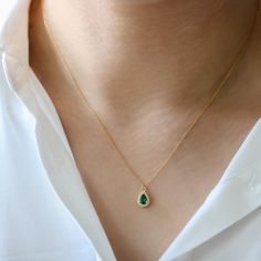 Elevate your style with our Emerald Teardrop Gold Filled Necklace, a stunning piece that instantly catches the eye and adds a touch of luxury to any outfit. This necklace features a classic teardrop-shaped emerald, beautifully surrounded by sparkling cubic zirconia diamonds, all set in high-quality gold-filled material. Designed to shine, this necklace is perfect for those who appreciate elegance and sophistication. The Perfect Gift for Any Occasion Whether you're searching for a birthday presen Gold Filled Necklace, Jewelry Minimalist, Gold Alloys, May Birthstone, Emerald Necklace, Diamond Chain, Teardrop Necklace, Minimalist Necklace, Gold Filled Jewelry