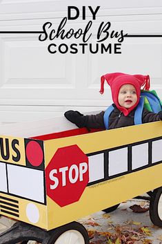 a toddler in a school bus costume