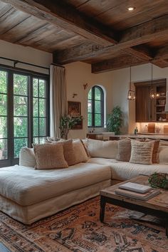 a living room filled with furniture and lots of windows