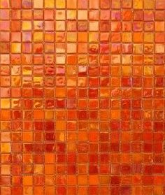 an orange and yellow mosaic tile wall