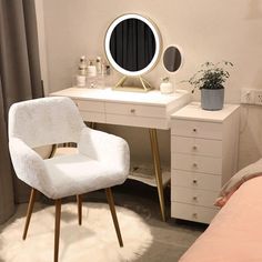 a white chair sitting in front of a desk with a mirror on top of it