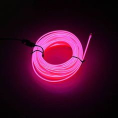 a pink neon light is shown in the dark, with one wire connected to it