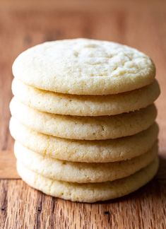 a stack of cookies sitting on top of a wooden table