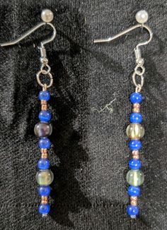 This earring the dangle earring with blue beads that are accented with other smaller multiple colors. Enjoy homemade earrings by B. B.  Hunay Designs. Homemade Earrings, Blue Beads, Last Minute Gifts, Favorite Jewelry, Jewelry Earrings Dangle, Dangle Drop Earrings, Dangle Earrings, Jewelry Earrings, Accessory Gift