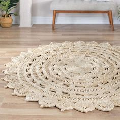 a round rug with crochet on the floor