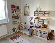 a child's room with toys and bookshelves on the wall