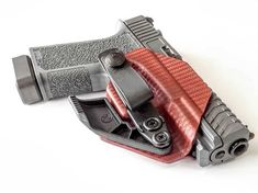 a red and black holster on a white background