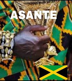 an african man wearing a green and yellow shirt with the words asantee on it