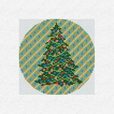 a cross stitch christmas tree on a white background