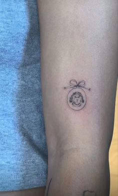 a person with a small tattoo on their arm