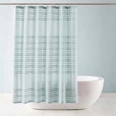 a shower curtain with blue and white stripes on it