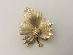 "Monet gold plated leaf brooch. Size: 2 1/8\" x 1 5/8\". Marked: copyright symbol Monet. Very good to excellent condition." Gold Flower Lapel Pin For Formal Occasions, Gold Leaf Brooch For Gift, Antique Gold Lapel Pin Collectible, Gold Flower Brooch Pins, Vintage Gold Leaf Jewelry, Antique Gold Flower Brooch, Antique Gold Flower Brooches, Gold Costume Jewelry Brooch For Anniversary, Vintage Gold Leaf-shaped Jewelry