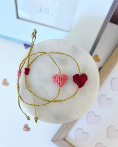 This set of wax thread macrame beaded Valentine heart bracelets are the perfect gift for Valentine's Day morning! Dainty and colorful, they can be worn every day as a reminder of the love the have from you! There is a box to add any personalization changes or text changes! With your purchase you receive: 1 Personalized card 1 Red Heart AND 1 Pink Heart wax thread macrame beaded bracelet (adjustable) 1 Box & Ribbon (31/2 x 31/2 x 1 inch box) Color of your choice! THE LOVE LEIGH GIFT PROMISE: Our Valentine's Day Friendship Bracelets With Heart Beads, Pink Braided Bracelet With Adjustable Cord As Gift, Heart-shaped Friendship Bracelets With Sliding Knot For Valentine's Day, Heart-shaped Friendship Bracelets With Heart Beads For Gift, Heart-shaped Beaded Bracelets For Friendship On Valentine's Day, Heart-shaped Friendship Bracelets With Heart Beads As Gifts, Heart Shaped Friendship Bracelets With Heart Beads As Gift, Multicolor Friendship Bracelets For Valentine's Day, Pink Adjustable Cord Friendship Bracelet As Gift