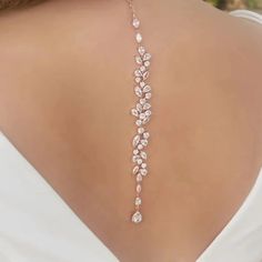 Make a statement on your special day with our exquisite bridal choker backdrop necklace. Crafted with high-quality materials, this piece is designed to elevate your bridal ensemble and add a touch of glamour to your look. Key Features: Made with zinc alloy and adorned with cubic zirconia, rhinestones, and simulated pearls for a luxurious appeal Body chain/back necklace chain material crafted from alloy and cubic zirconia crystal for a dazzling effect Exudes elegance and sophistication, making it Glamorous Silver Backdrop Necklace For Wedding, Glamorous Backdrop Necklace For Weddings, Silver Cubic Zirconia Backdrop Necklace For Wedding, Silver Delicate Backdrop Necklace For Wedding, Delicate Dangle Backdrop Necklace For Wedding, Elegant Drop Backdrop Necklace For Wedding, Back Necklace Wedding, Bridal Backdrop Necklace, Backdrop Necklace