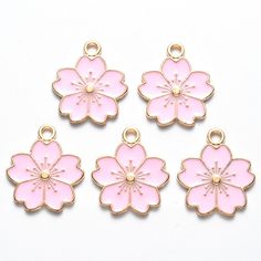 pale pink enamel sakura flower charm Pale gold tone alloy base. choose from a set of 2 or a set of 5 Approximately 20.5mm x 17mm x 1.5mm   hole size 2mm Not suitable for children postage will only be applied to the first item in the basket: Sakura Necklace, Rose Gold Flower, Light Pink Flowers, Jewelry Making Earrings, Sakura Flower, Pink Blossom, Jewelry Making Charms, Pink Enamel, Enamel Flower