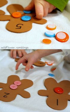 a child's hand touching buttons on a paper plate