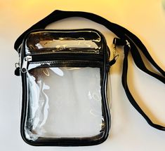 Be prepared for your next event with our Clear Stadium Approved Game Day Bags / Concert Venue. You can wear them either as crossbody bag or shoulder purse.  this cute clear purse bag can help you quickly pass the security check.  Material: thick quality PVC bag with a removable nylon strap,  Measurements:7.5 x 5.9 x 1.8 inches Strap measures 27.6 - 57.1 inches  It is suitable to hold many things, such as a wallet, mobile phone, cosmetics, etc., in addition, there is a front pocket which is ideal for small items. **These are stadium, concert, venue approved clear bags, but double-check with the venue for official bag rules.  **Bags can be personalized, please dm me before placing your order** Clear Shoulder Bag With Adjustable Strap, Clear Crossbody Shoulder Bag With Zipper, Clear Shoulder Bag With Transparent Straps, Stadium Bags Clear, Clear Stadium Crossbody Bag, Clear Stadium Bag, Stadium Bag, Clear Purses, Concert Venue