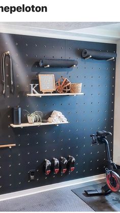 there is a bike and some shelves on the wall in this room with blue walls