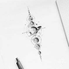 a pen drawing of the planets and their satellites on top of a sheet of paper