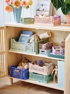 a book shelf filled with lots of books and boxes