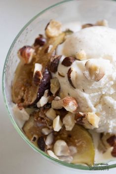 a bowl filled with ice cream and nuts