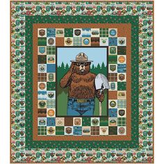 a quilt with a bear holding a shovel