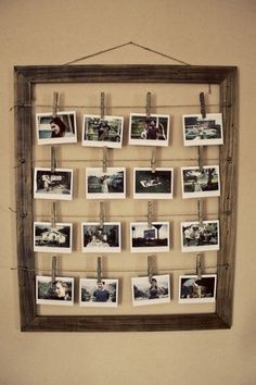 an old wooden frame with photos hanging on it