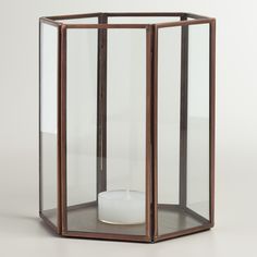 a wooden and glass display case on a white surface