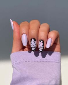 Embrace the freedom of spring with these 25 butterfly nail designs. From delicate accents to bold motifs, explore a variety of charming nail art ideas inspired by nature's fluttering beauties, perfect for welcoming the season with style. Butterfly Almond Nails, Nail Art Designs Almond, Lavender Nail Art, Almond Nail Art Designs, Butterfly Wing Nails, Purple Butterfly Nails, Nails Butterflies, Nails With Butterflies, Butterfly Nail Design