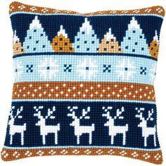 a blue and brown pillow with reindeers on it