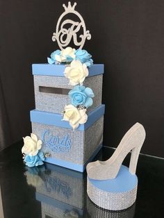 a blue and white wedding cake with high heels